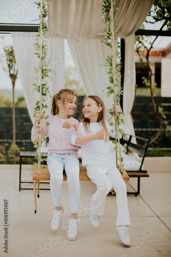 Cute little girls on the sw...