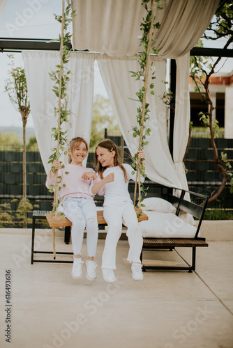 Cute little girls on the sw...
