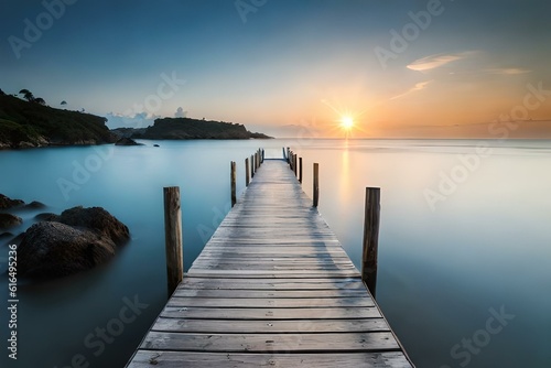 A charming wooden bridge over calm, crystal-clear waters, surrounded by lush greenery and with the sea stretching out to the horizon.