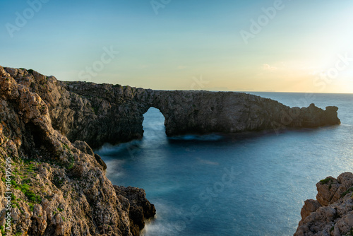 Sunset at Pont d’en Gil at the west coast of Menorca. Balearic Islands, Spain.