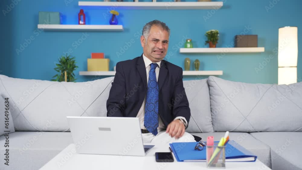 Home office worker man looking at camera with disgust and hatred. Home office worker man looking at camera with disgust and hatred.
