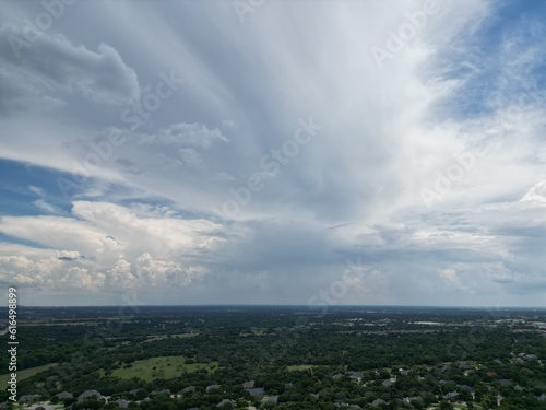 Cumulonimbus storm clouds over rural country land.