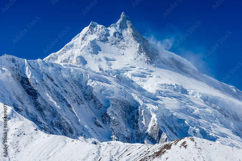 Himalaya scenic mountain landscape against the blue sky. Manaslu mountain