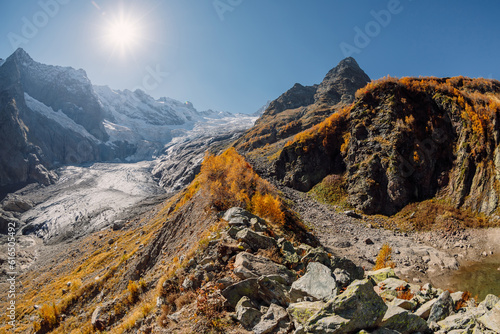 Higest mountains with glacier. Peak of mountain and ice glacier in sunny day photo
