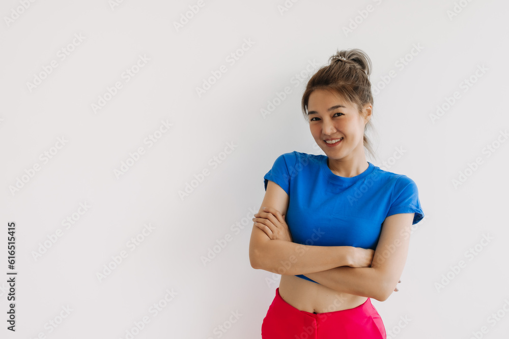 Happy asian woman in colorful clothes stand crossed arms isolated on white. Happy asian woman in colorful clothes stand crossed arms isolated on white.