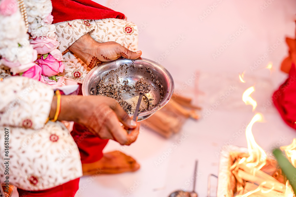 Fototapeta premium Indian Hindu wedding ritual hands close up