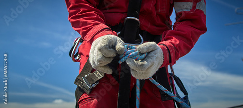 A specialist is repairing the roof. Rope access photo