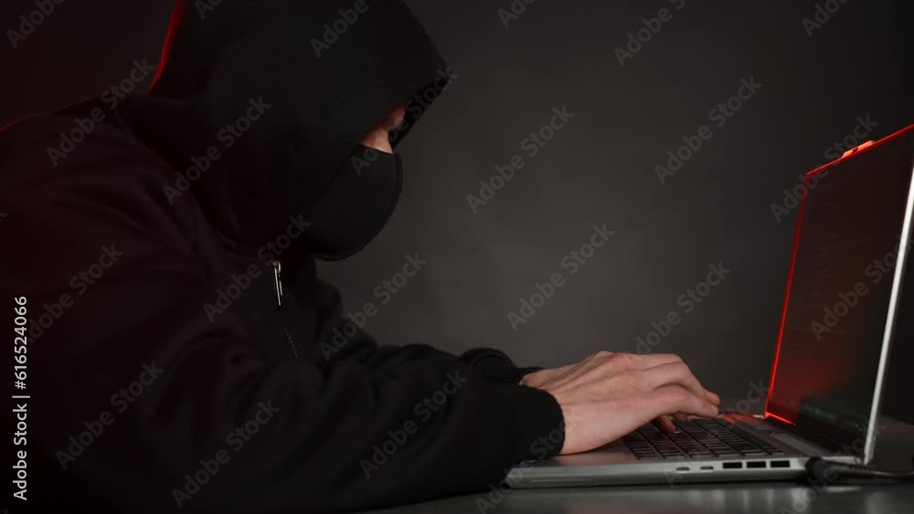 Hacker working on a laptop. Dolly shot Hacker working on a laptop. Dolly shot