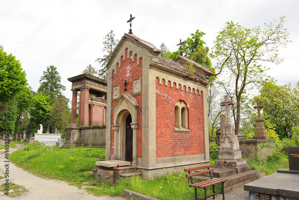  Ancient mausoleums (crypts) and tombstones at the famous Lychakiv Cemetery in Lviv, Ukraine