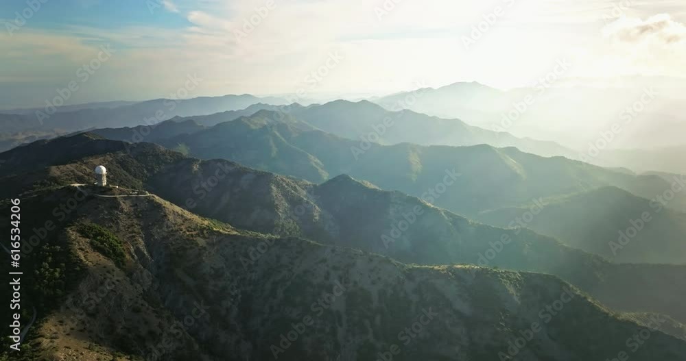 Heavenly Horizons: Serenading the Senses with Breathtaking Aerial Views of Majestic Mountain Landscapes During Enchanting Sunset Moments. High quality 4k footage Heavenly Horizons: Serenading the Senses with Breathtaking Aerial Views of Majestic Mountain Landscapes During Enchanting Sunset Moments. High quality 4k footage