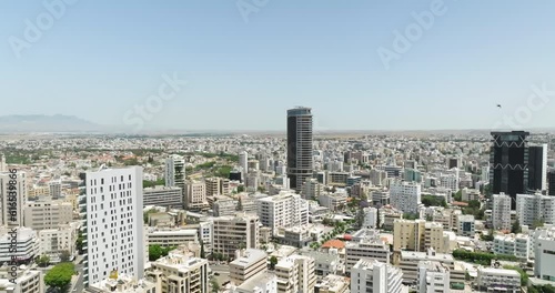 Aerial view of the cityscape of Nicosia, Cyprus. Skyscrapers in the downtown of the city drive traffic from cars. The life of a metropolis on an island. High quality 4k footage photo