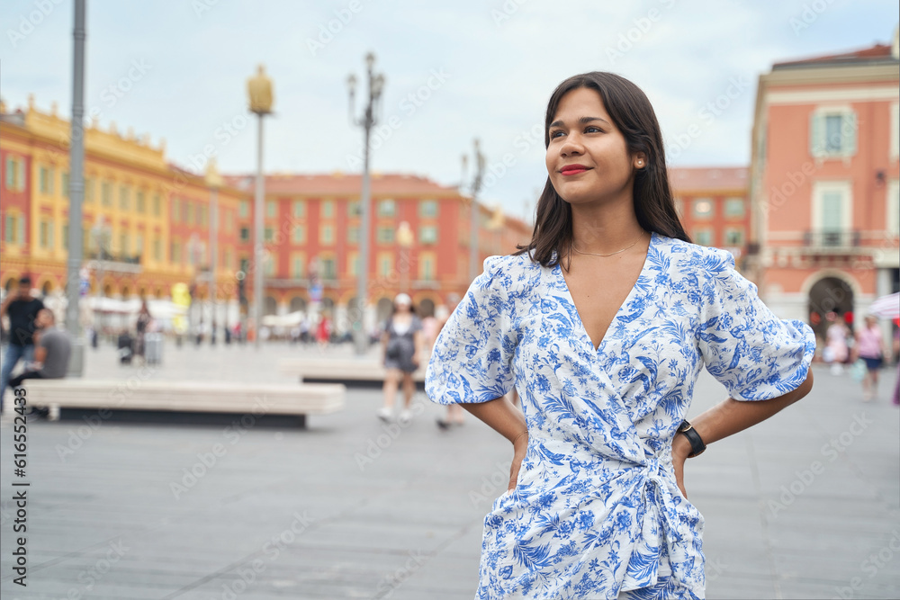 Beautiful young mixed race woman at Place Massena in Nice, France