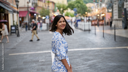 Beautiful young mixed race woman in the old town of Nice, France