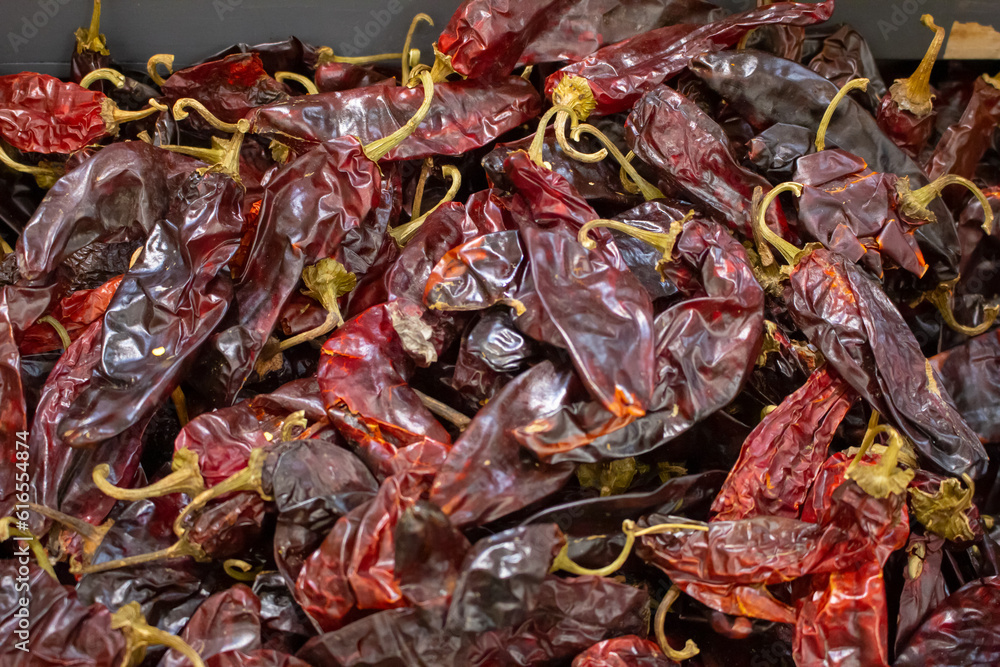A view of a bin full of dried chile New Mexico, on display at a local grocery store.