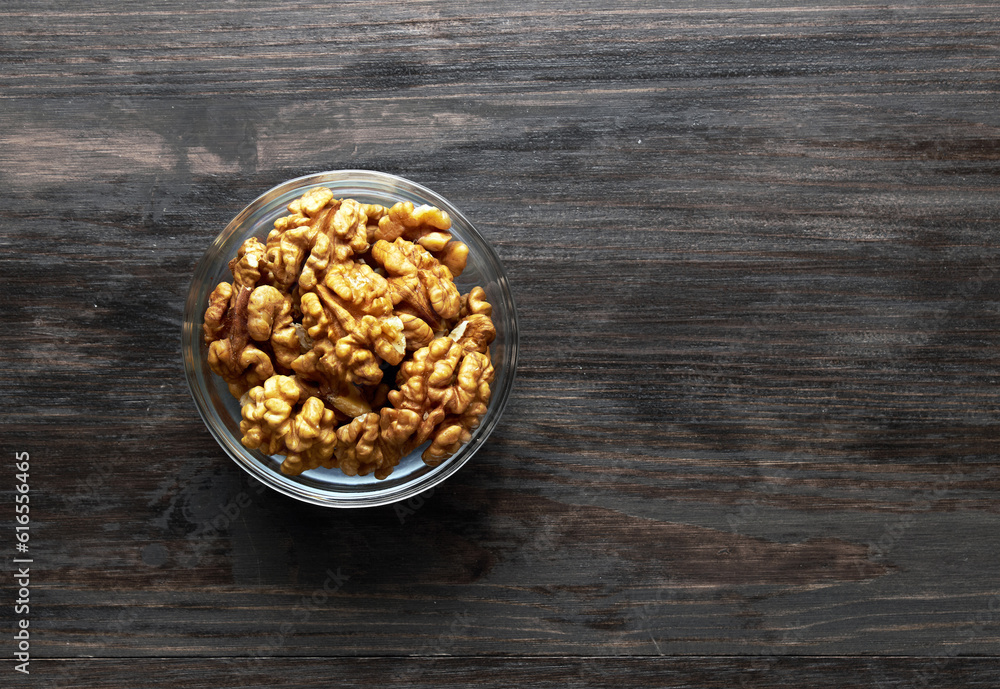 Walnut in bowl on a wood Walnut in bowl on a wood