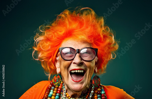 Photo of a happy elder woman with vibrant orange hair and stylish sunglasses