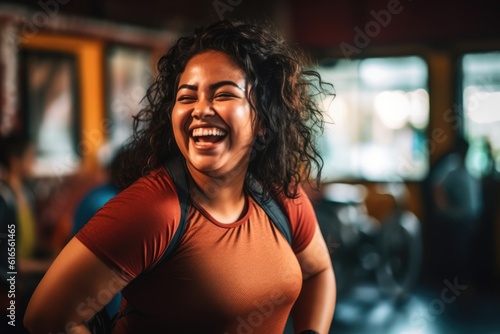 An energetic close - up shot capturing a playful, overweight woman mid - laugh during her fitness routine. Generative AI