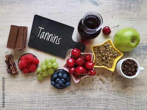 Tannins rich foods and drinks. Natural food sources of tannins. Tannins are a type of bitter chemical compound, polyphenols, found in many plants. Wine, chocolate, herbal tea, coffee, grape, berries. photo