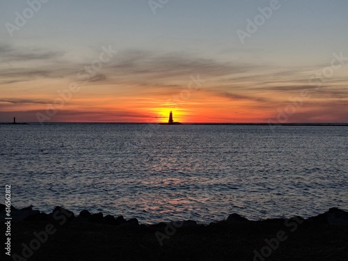 sunset behind lighthouse © Francesca