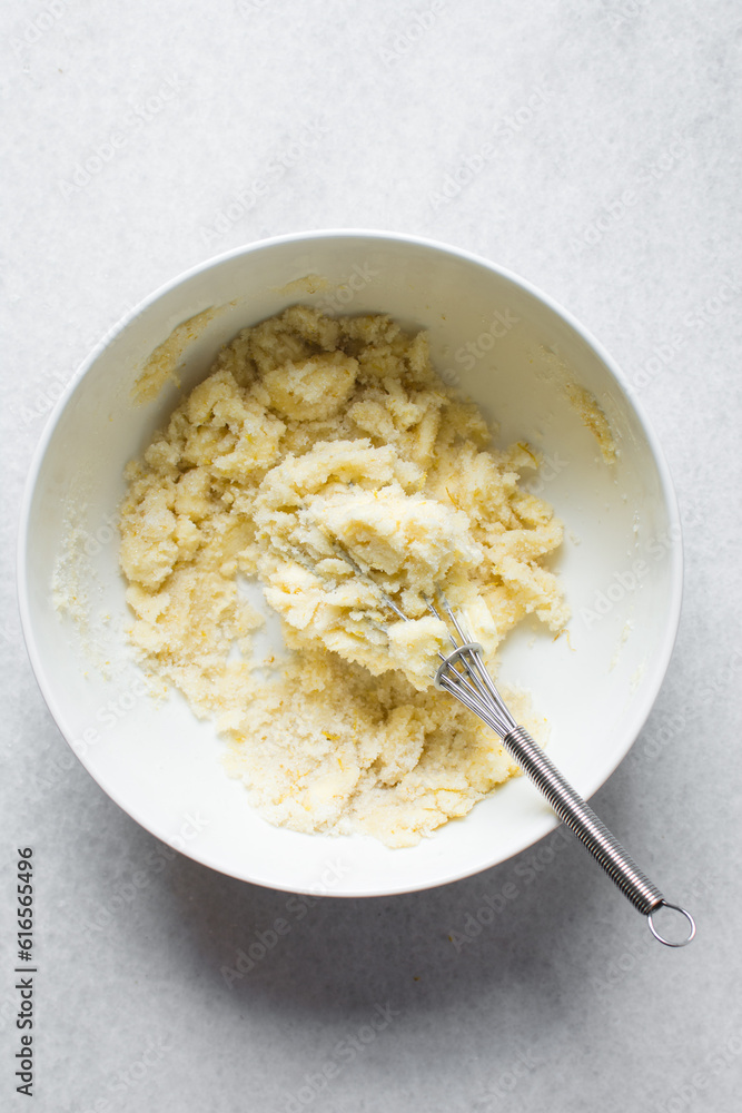 Creaming butter and sugar with a whisk, the process of making a cake, mixing butter and sugar to make a cake Creaming butter and sugar with a whisk, the process of making a cake, mixing butter and sugar to make a cake