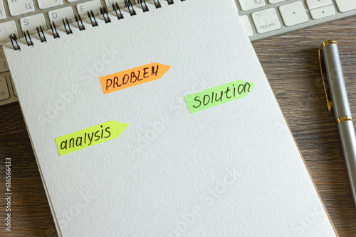 Problem, analysis, solution. Stickers with text in notepad, keyboard with pen on wooden table.