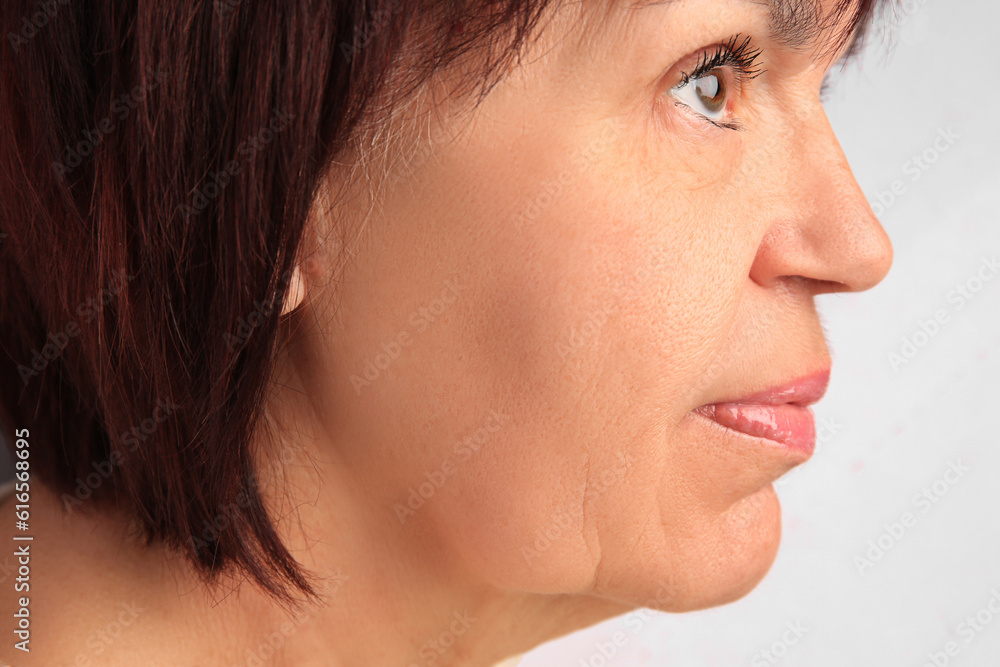 Closeup view of older woman on white background Closeup view of older woman on white background