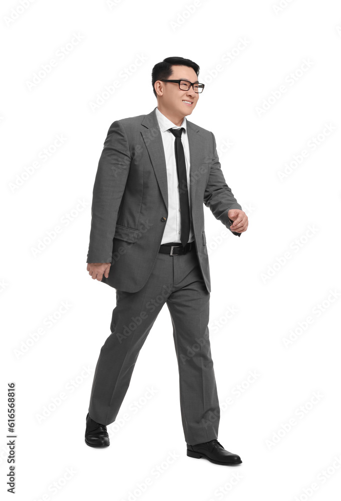 Businessman in suit walking on white background Businessman in suit walking on white background