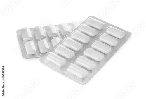 Blisters with chewing gums on white background