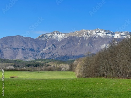 A view of the northern slopes of Velebit from Lika and the spring snow on its picturesque peaks, Sveti Rok - Croatia (Pogled na sjeverne obronke Velebita iz Like i snijeg na vrhovima, Hrvatska) photo