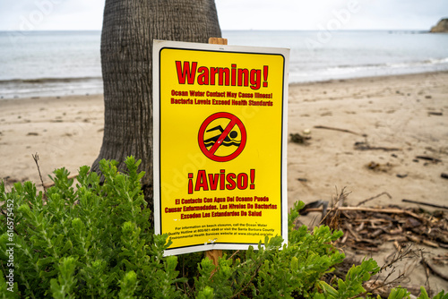 Warning sign for swimming on the beach photo