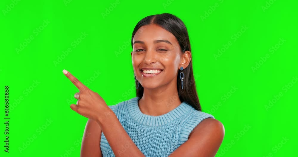 Green screen, face and woman pointing to mockup space, advertising and presentation of deal in studio. Happy portrait, indian female model and yes to review, promotion and good news for sales offer Green screen, face and woman pointing to mockup space, advertising and presentation of deal in studio. Happy portrait, indian female model and yes to review, promotion and good news for sales offer