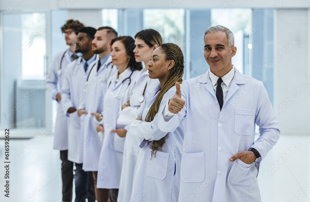 Group of experienced doctors from different of filed working together as primary healthcare team to give medical diagnosis, treatment to patients. Developing positive relationships with colleagues. Group of experienced doctors from different of filed working together as primary healthcare team to give medical diagnosis, treatment to patients. Developing positive relationships with colleagues.
