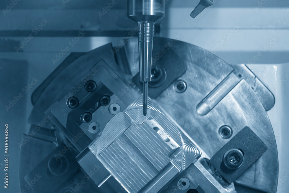 The 5-axis CNC milling machine cutting the automotive parts with ball end mill tool. The 5-axis CNC milling machine cutting the automotive parts with ball end mill tool.
