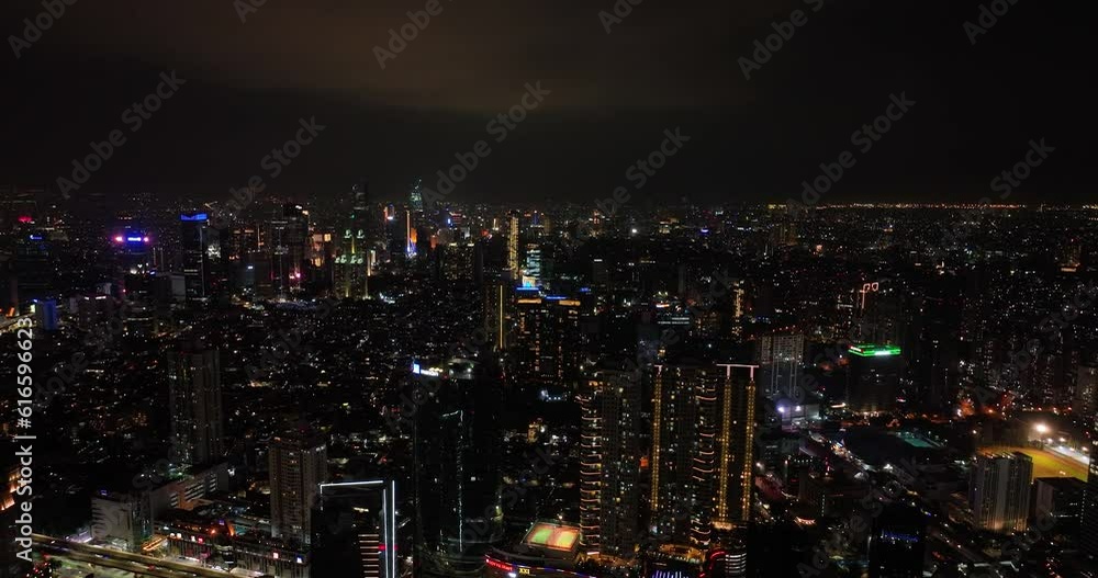 Jakarta with skyscrapers and the illumination of the night view from above. Jakarta with skyscrapers and the illumination of the night view from above.
