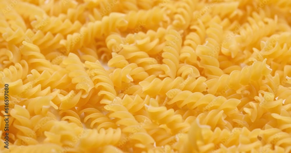pasta backgroud - macro view of Dry Authentic Italian fusilli pasta backgroud - macro view of Dry Authentic Italian fusilli