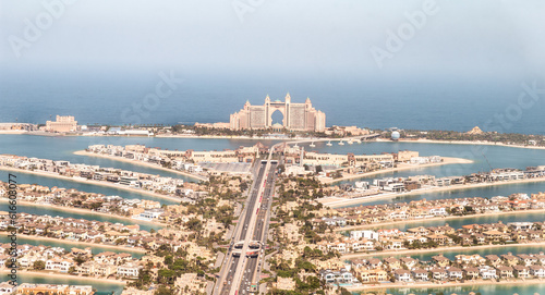 View from observation deck of the Nakheel Mall building to the Palm Jumeirah island and Atlantis Hotel in Dubai city, United Arab Emirates photo