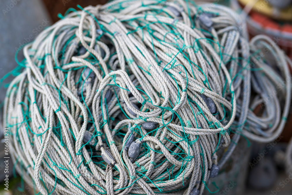Close up of a rolled up fishing net in the harbor