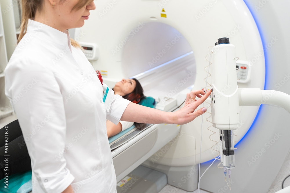 Female patient undergoing MRI - Magnetic resonance imaging in Hospital. Medical Equipment and Health Care Female patient undergoing MRI - Magnetic resonance imaging in Hospital. Medical Equipment and Health Care