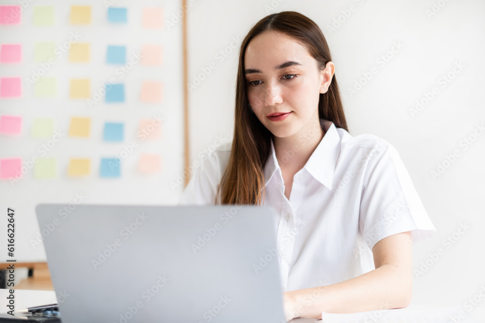businesswomen sit at their desks and calculate financial graphs showing results about their investments, planning successful business growth processes in the office businesswomen sit at their desks and calculate financial graphs showing results about their investments, planning successful business growth processes in the office