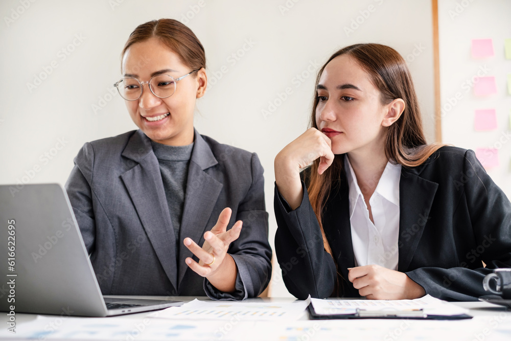 Two business leaders talk about charts, financial graphs showing results are analyzing and calculating planning strategies, business success building processes Two business leaders talk about charts, financial graphs showing results are analyzing and calculating planning strategies, business success building processes