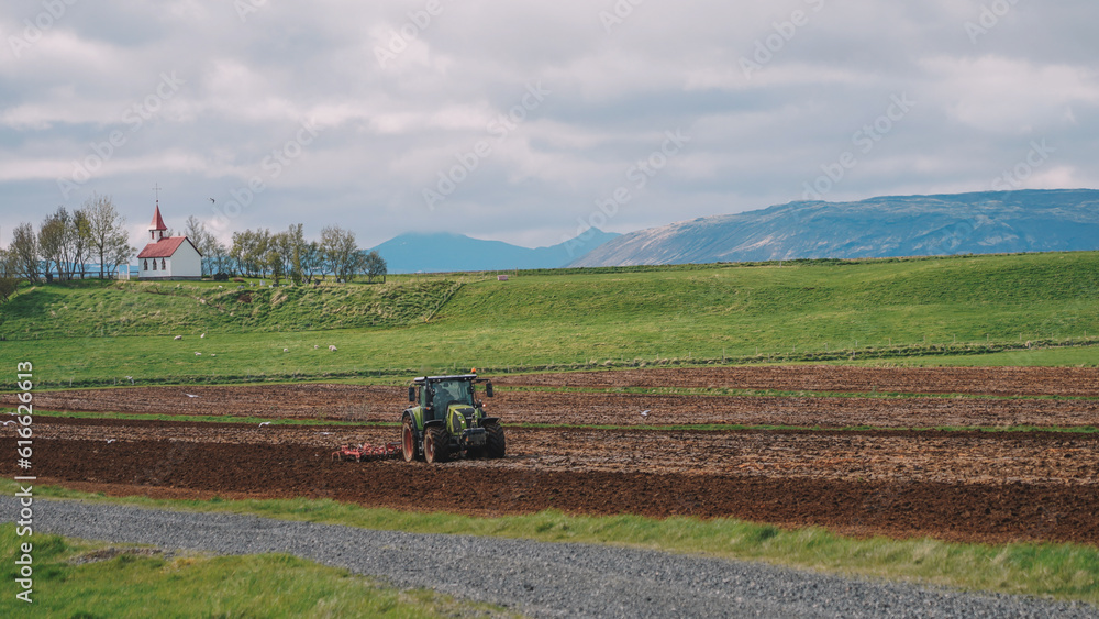 Fototapeta premium Tractor Cultivating process aerial view