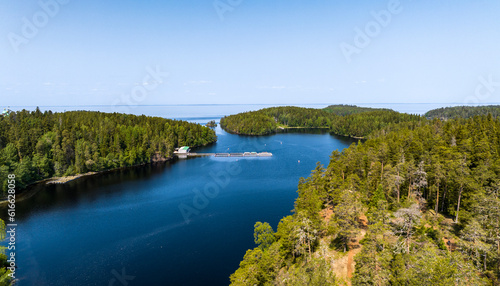 panoramic view of the Valaam skerries and monasteries against the backdrop of blue water and a sunny day