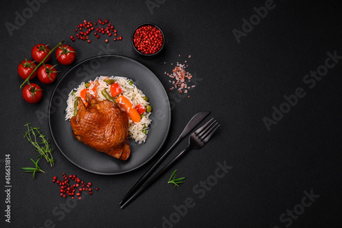 Delicious boiled rice with chicken and vegetables or risotto with salt, spices and herbs