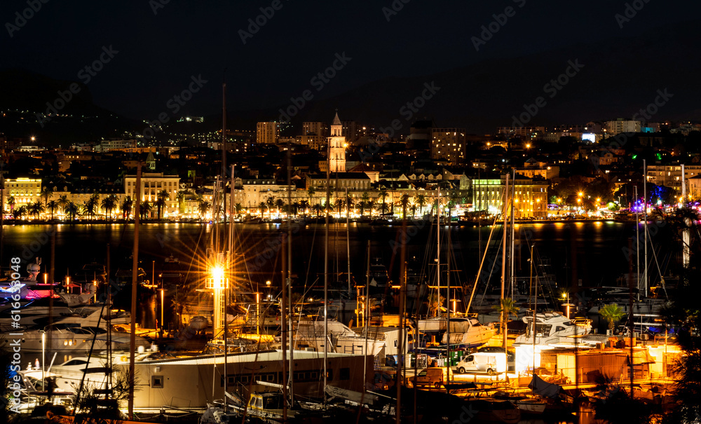 Split, Croatia. Split second largest city of Croatia at night. Shore of the Adriatic Sea and famous Palace of the Emperor Diocletian. Traveling concept background. Mediterranean