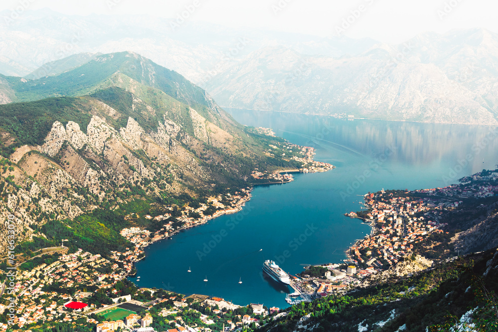 Aerial View Bay of Kotor with cruise ships and smaller vessels coming from the Adriatics and coastline with histori