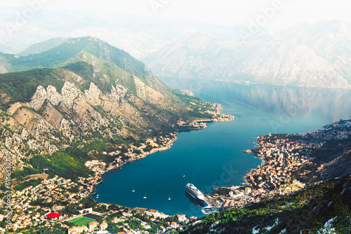 Aerial View Bay of Kotor with cruise ships and smaller vessels coming from the Adriatics and coastline with histori