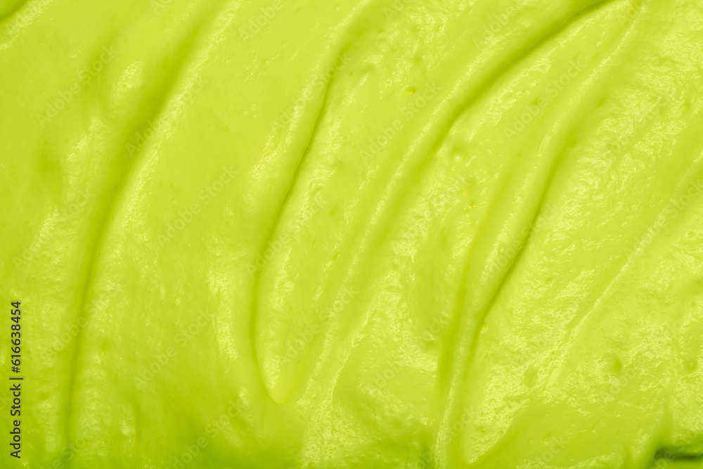 Cake cream texture, sweet whipped cream. Background of yogurt close-up with a pattern. Pistachio mousse. Cake cream texture, sweet whipped cream. Background of yogurt close-up with a pattern. Pistachio mousse.