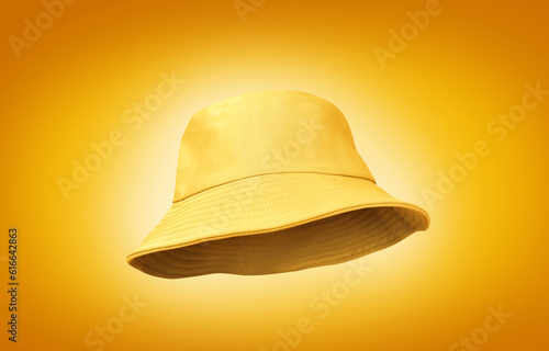 yellow bucket hat isolated on a yellow background