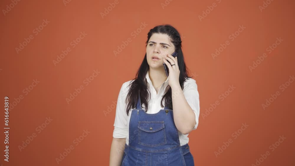 Angry woman talking on the phone. Angry woman talking on the phone.