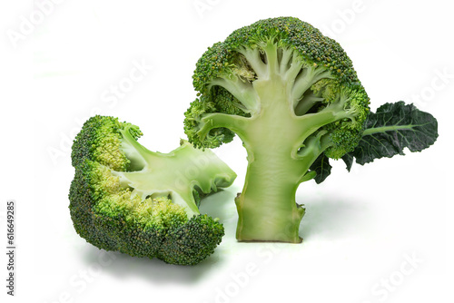 2 half cutted separate small broccoli isolated on white background as vegetable package design element